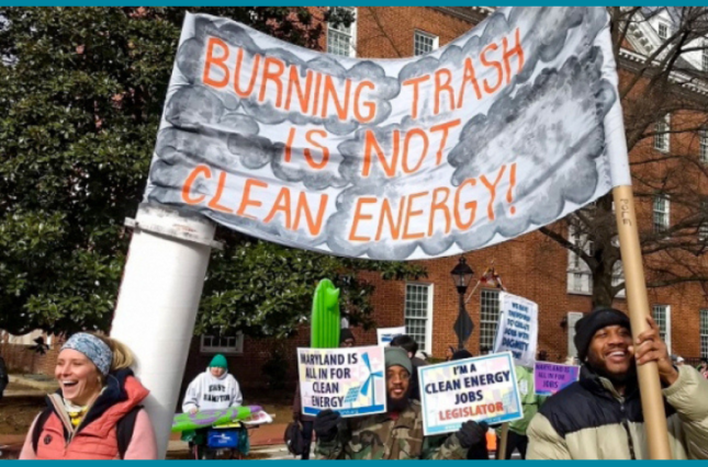 a graphic on a blue background with blue, orange, black, and white accents. Text at the top reads "Thank you, Maryland Commission on Climate Change!" An image in the middle shows people smiling and holding signs that say "Burning Trash is Not Clean Energy," "Maryland is All In for Clean Energy," and "I'm a Clean Energy Voter." Text at the bottom reads "for voting to recommend ending "renewable energy" subsidies for trash incineration."