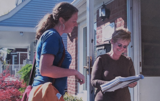 Clean Water Action field canvasser speaking to a member on her doorstep